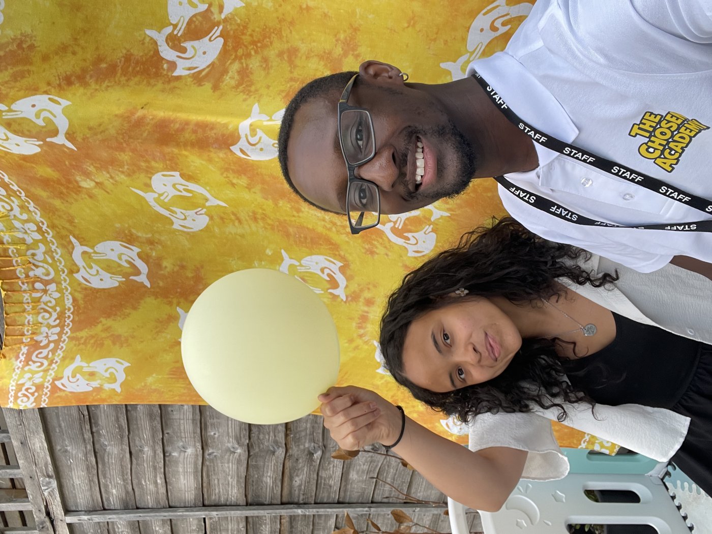 Trae with an attendee at a community event